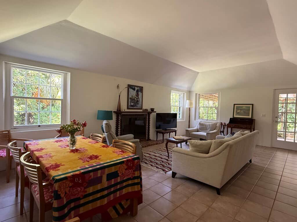 Large dining room table in open plan living space. Can seat 6 comfortably and table expands to seat 10.