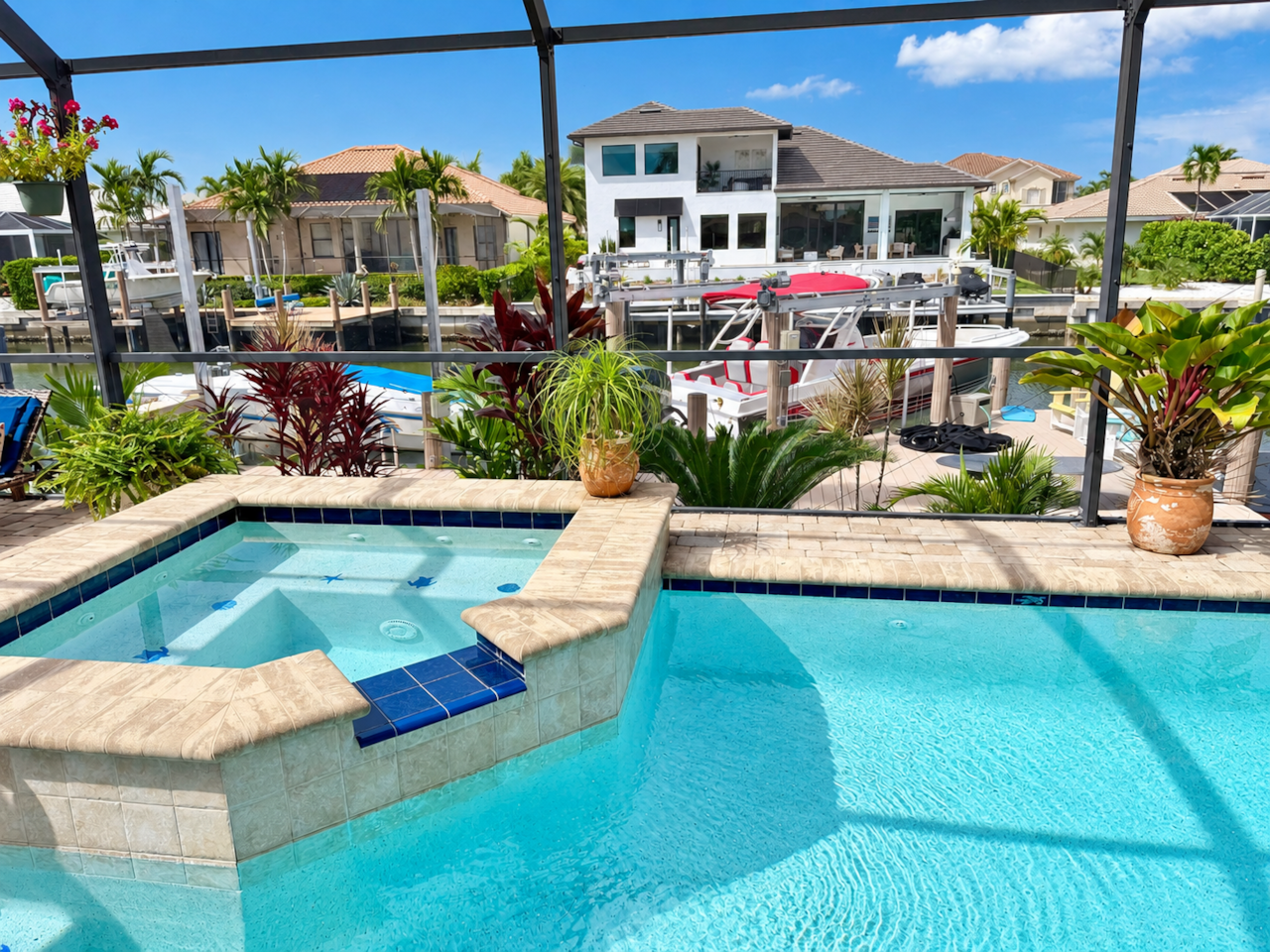 Pool, spa, and canal view