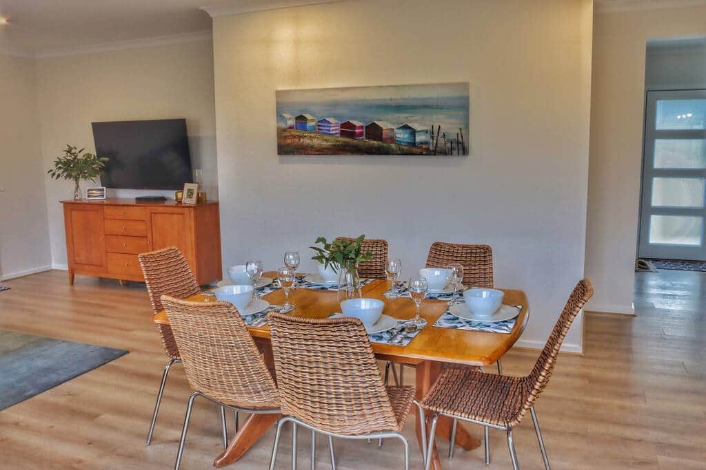 Open plan dining, kitchen and living with extension table to seat 8.