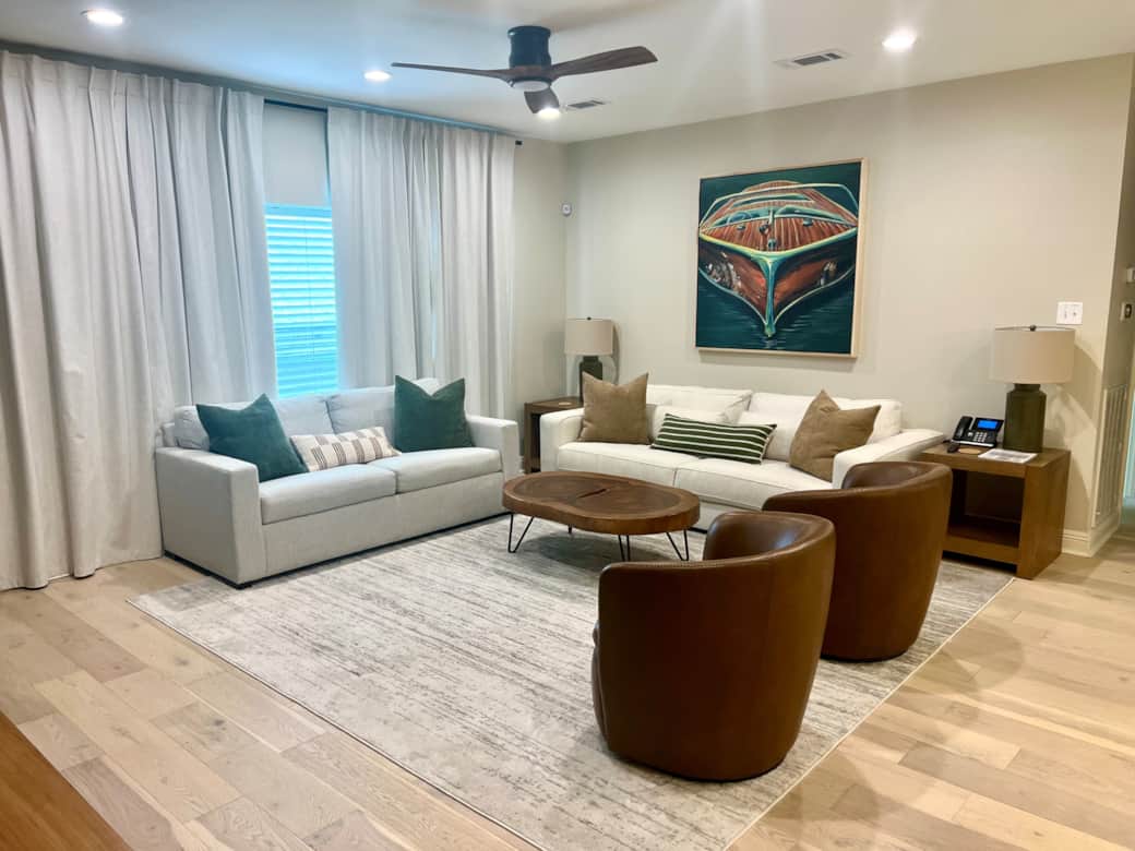 Living Room: Large TV for entertainment.  The two chairs can swivel to face the living room or the dining/kitchen area.  Sleep three in this room.  Pull out sofa bed with memory mattress next to the window, and an oversized sofa for a single bed.
