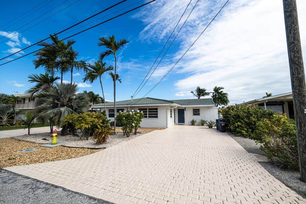 Frontyard - Pull right up to the door with a large private driveway, room for several cars and tropi