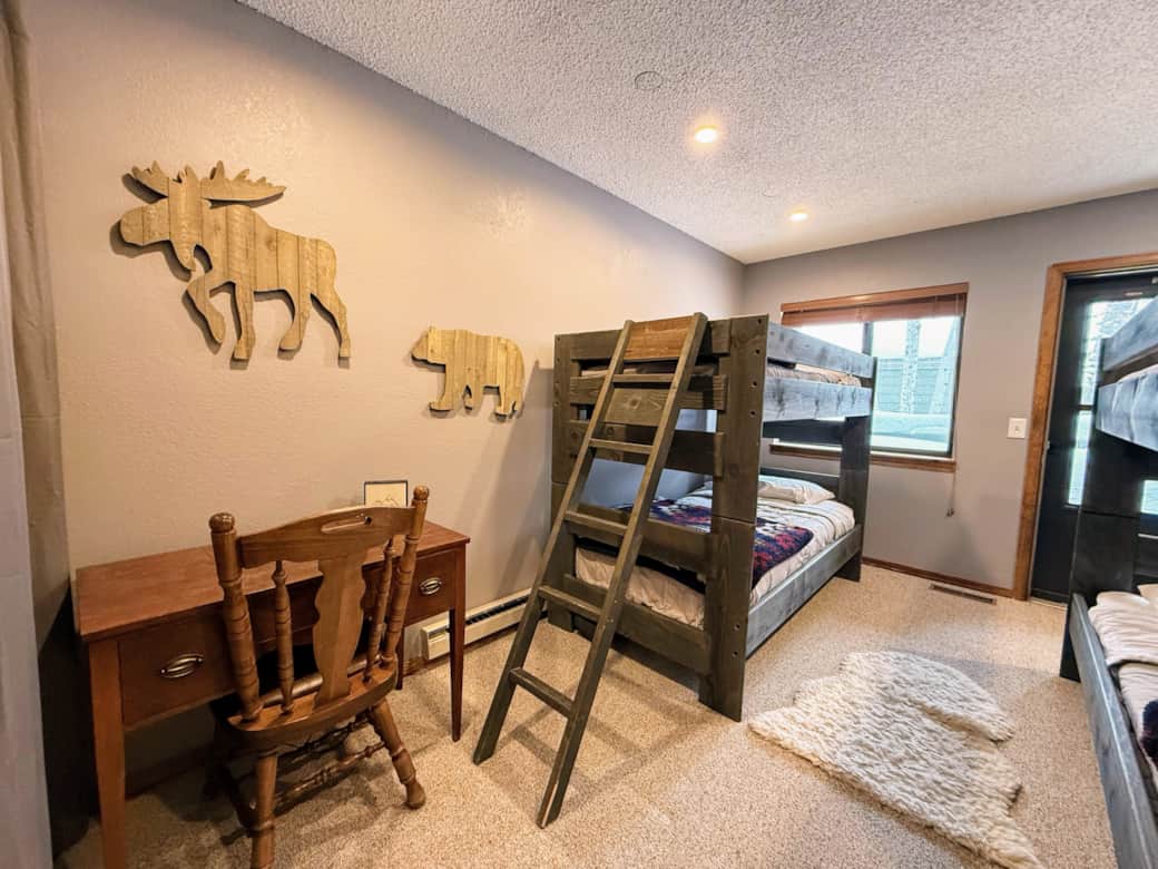 Bedroom #1 is located on the main floor with two sets of twin bunk beds and private patio.