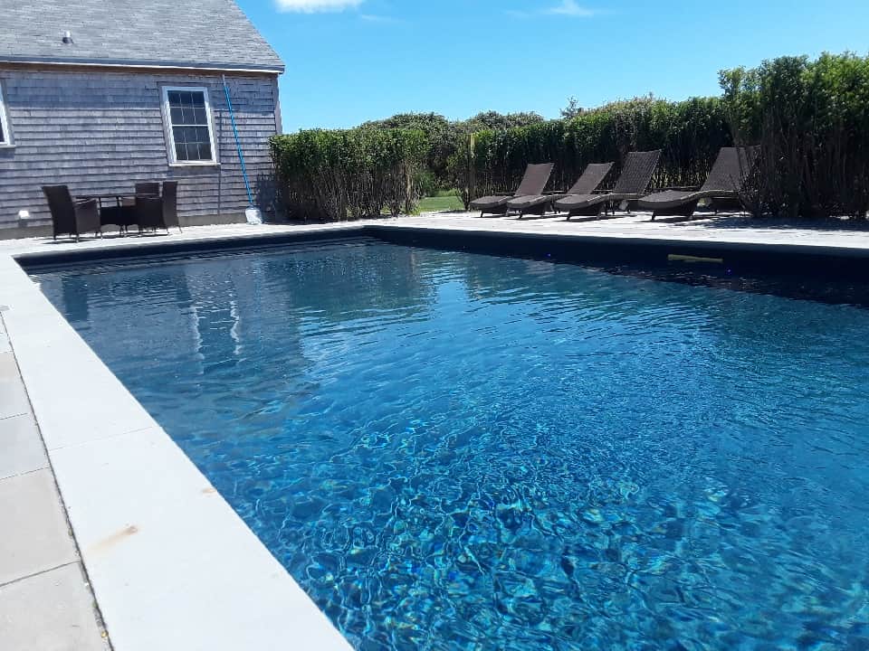 Pool w furniture from West.  Full steps on east end for chillin' !!