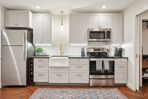 Full kitchen with range, refrigerator and dishwasher at Capitol Hill East House