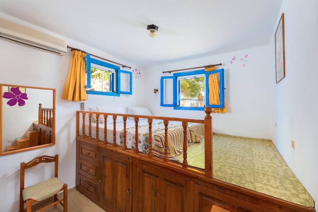 Bedroom with traditional Lindian style bed