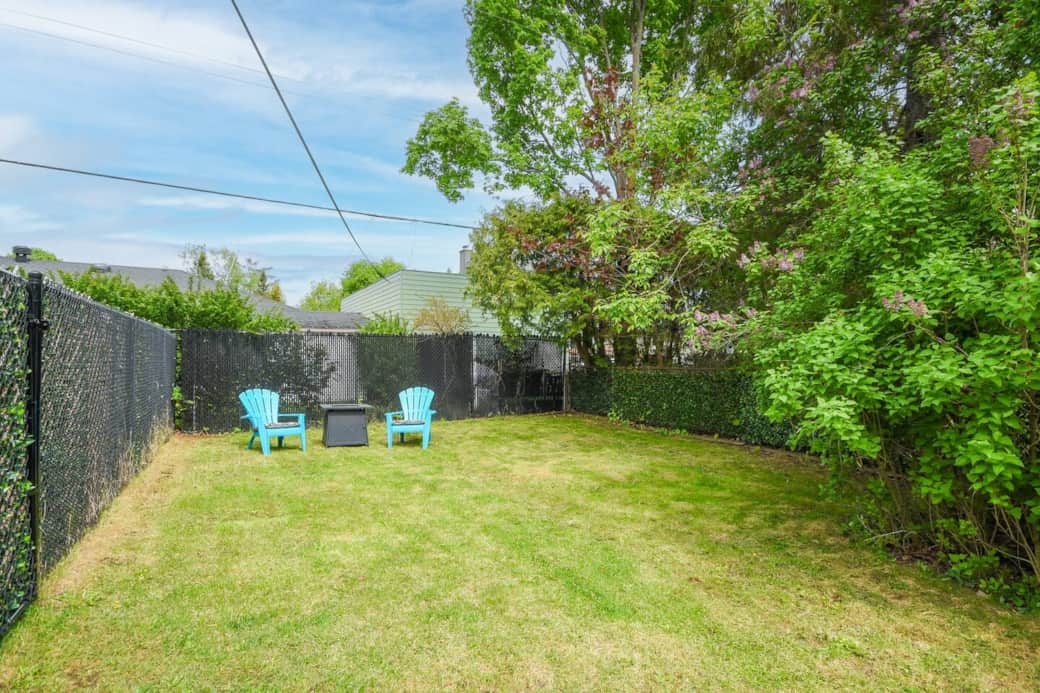 Enjoy your morning coffee or evening drinks in the spacious partially fenced backyard featuring a lush lawn in Ottawa.