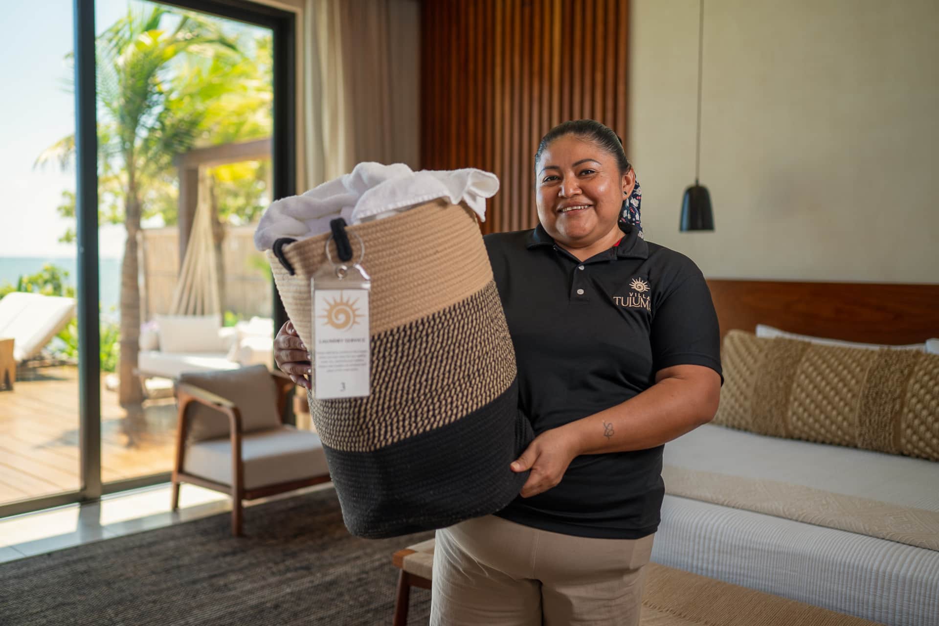 Laundry service preparing linens at Villa TuluMar