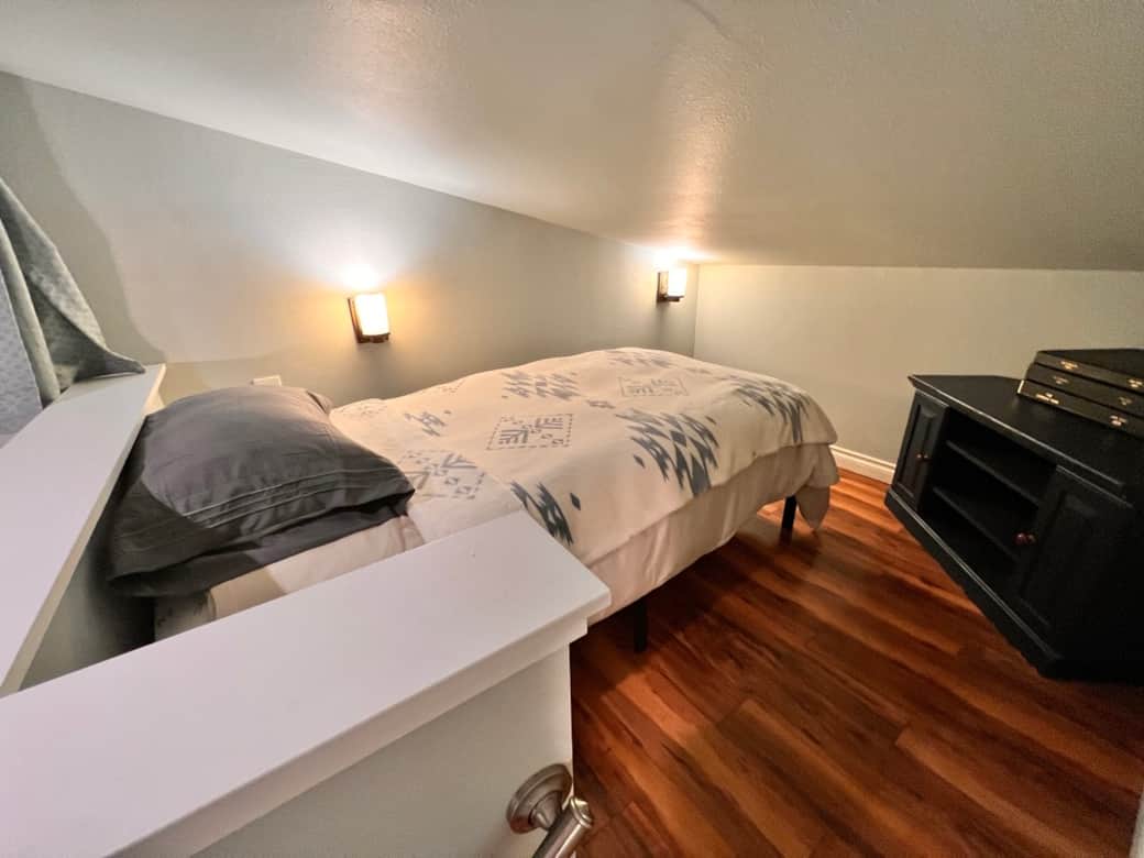 Warm lighting, soft linens, and a peaceful loft retreat. ✨🛏️🏔️