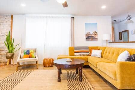 [Living Room]Spacious indoor seating area with TV, record player, and board games.