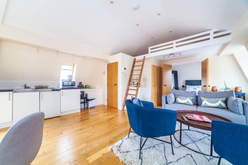 Open Plan living room with steps up to mezzanine sleeping area