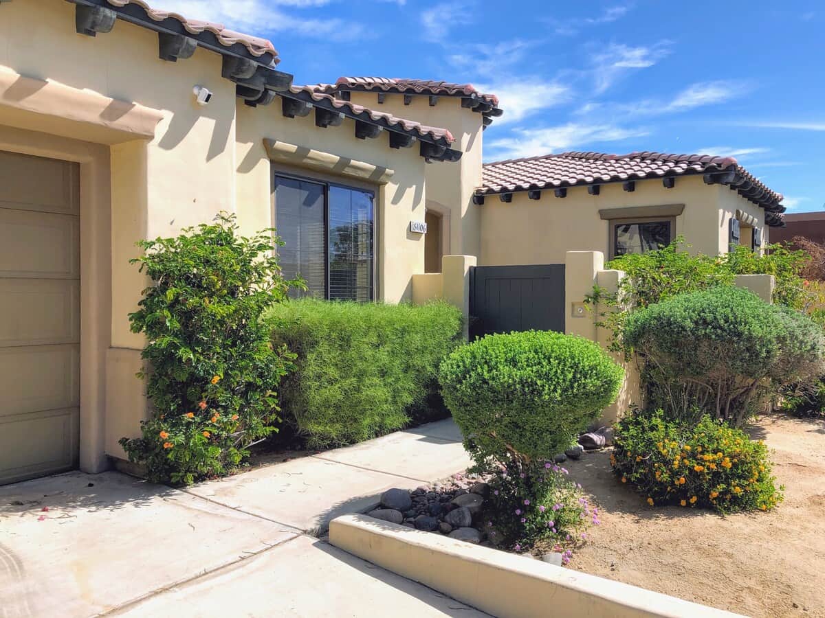 The driveway has a smooth path to the front door where there is about a 2”-3” high door bottom plate at the entry.  