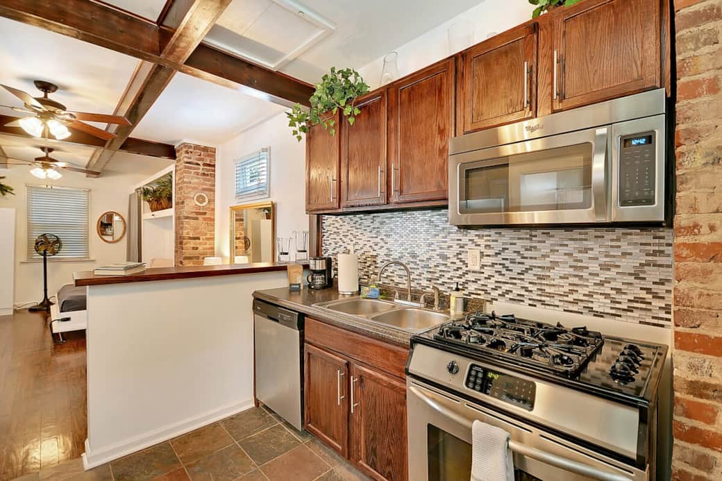 Fully stocked kitchen with new stainless appliances. Fully stocked kitchen with new stainless appliances.