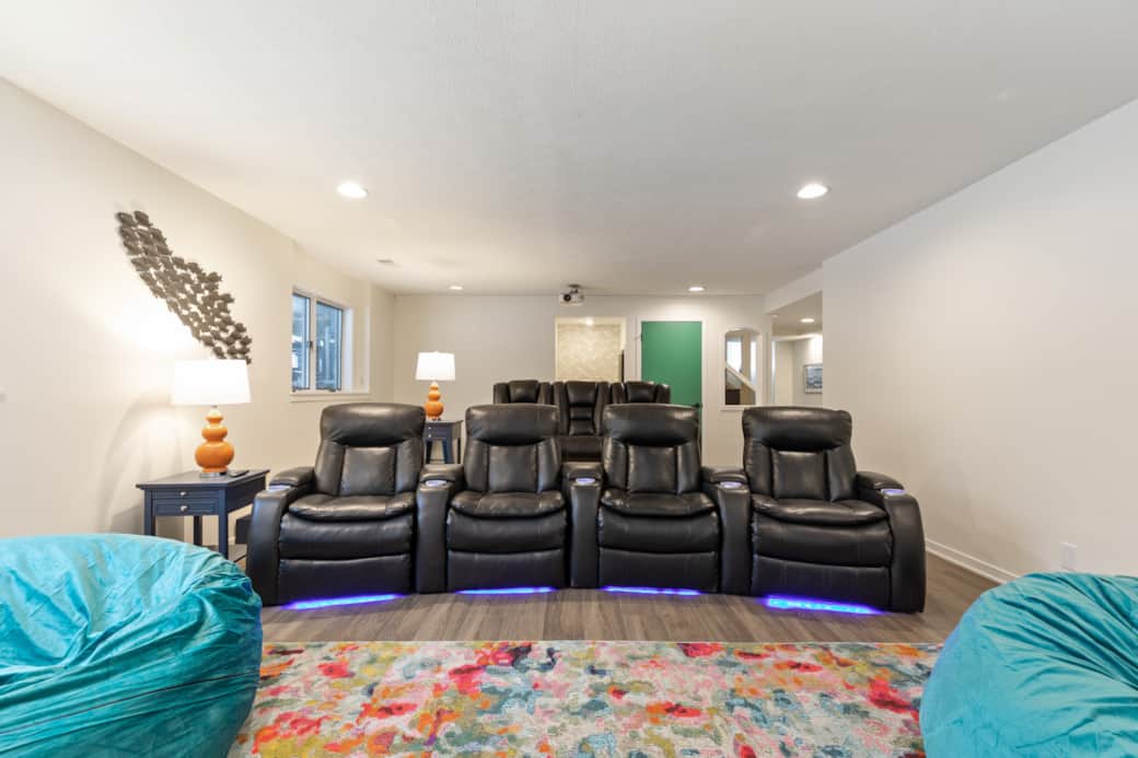 Ultimate theater room with bean bags, wet bar, stadium seating, and a massive 165" projector screen! Ultimate theater room with bean bags, wet bar, stadium seating, and a massive 165" projector screen!