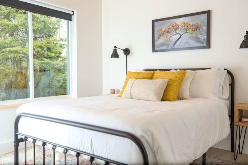 Bedroom 1 includes a Queen-sized gel memory foam mattress. The window lets in lots of natural light, but also has blackout shades as well for sleeping in as late as you want.