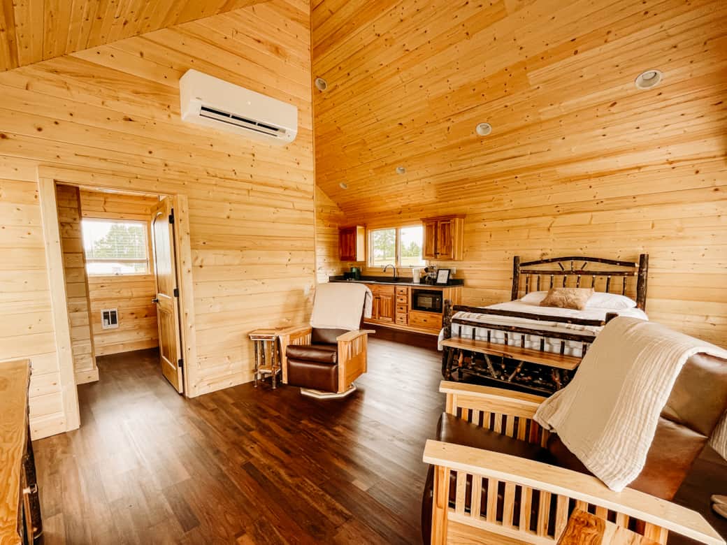 The Gobbler Cabin studio view of bed and kitchenette