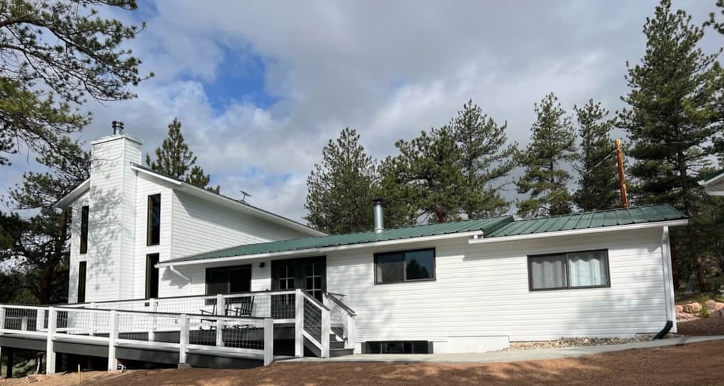 Exterior of the cabin with wrap around deck and wheelchair accessible ramp
