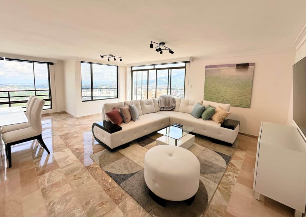 The open-plan living room is filled with light.