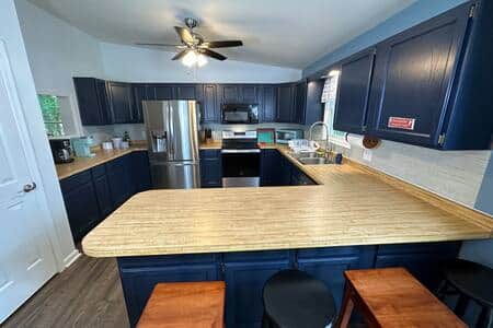 Large kitchen with lots of counter space and several appliances Large kitchen with lots of counter space and several appliances