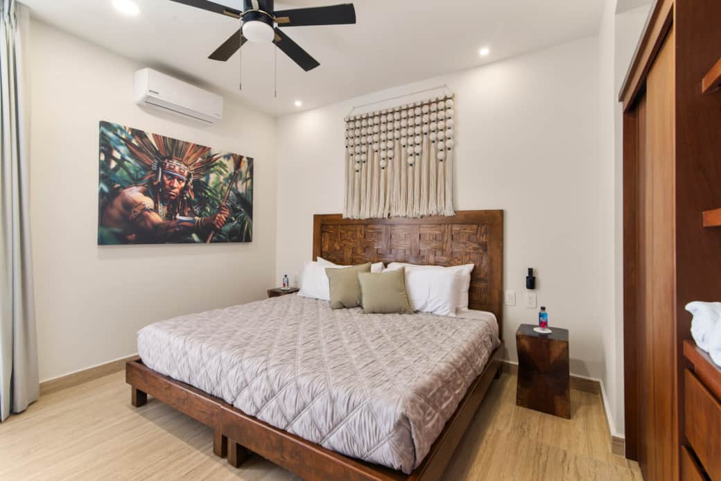 Second bedroom featuring a cozy king bed and blackout curtains for a restful nights sleep. Second bedroom featuring a cozy king bed and blackout curtains for a restful nights sleep.