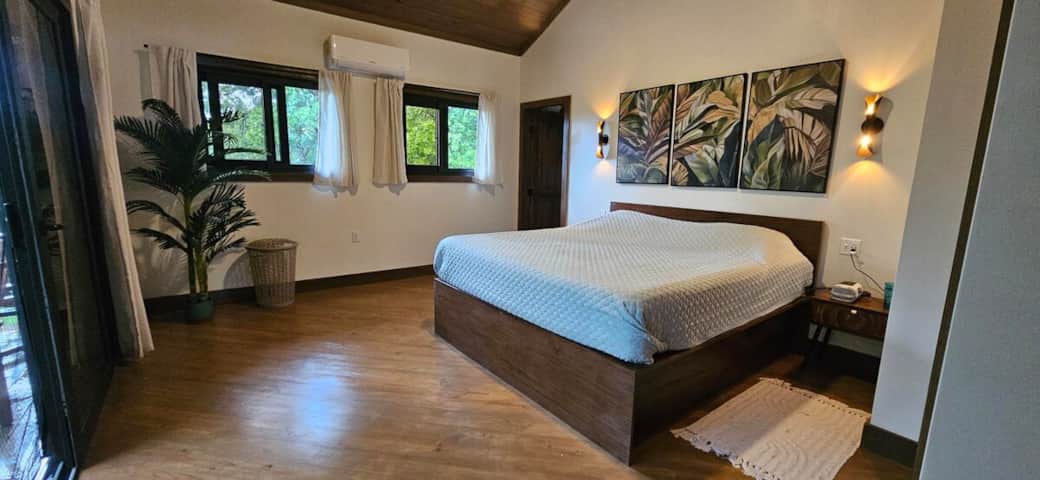 Spacious king bedroom with a luxurious mattress and fantastic views to the ocean