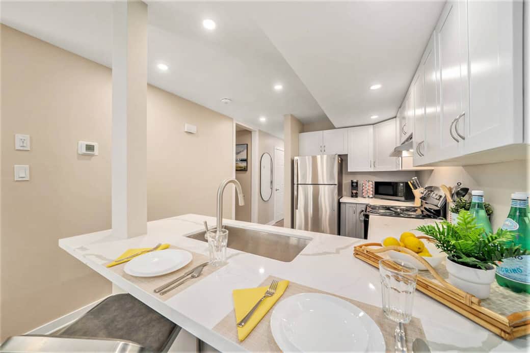 A cozy living room featuring a 47" smart TV, family games, books, and storage. A cozy living room featuring a 47" smart TV, family games, books, and storage.