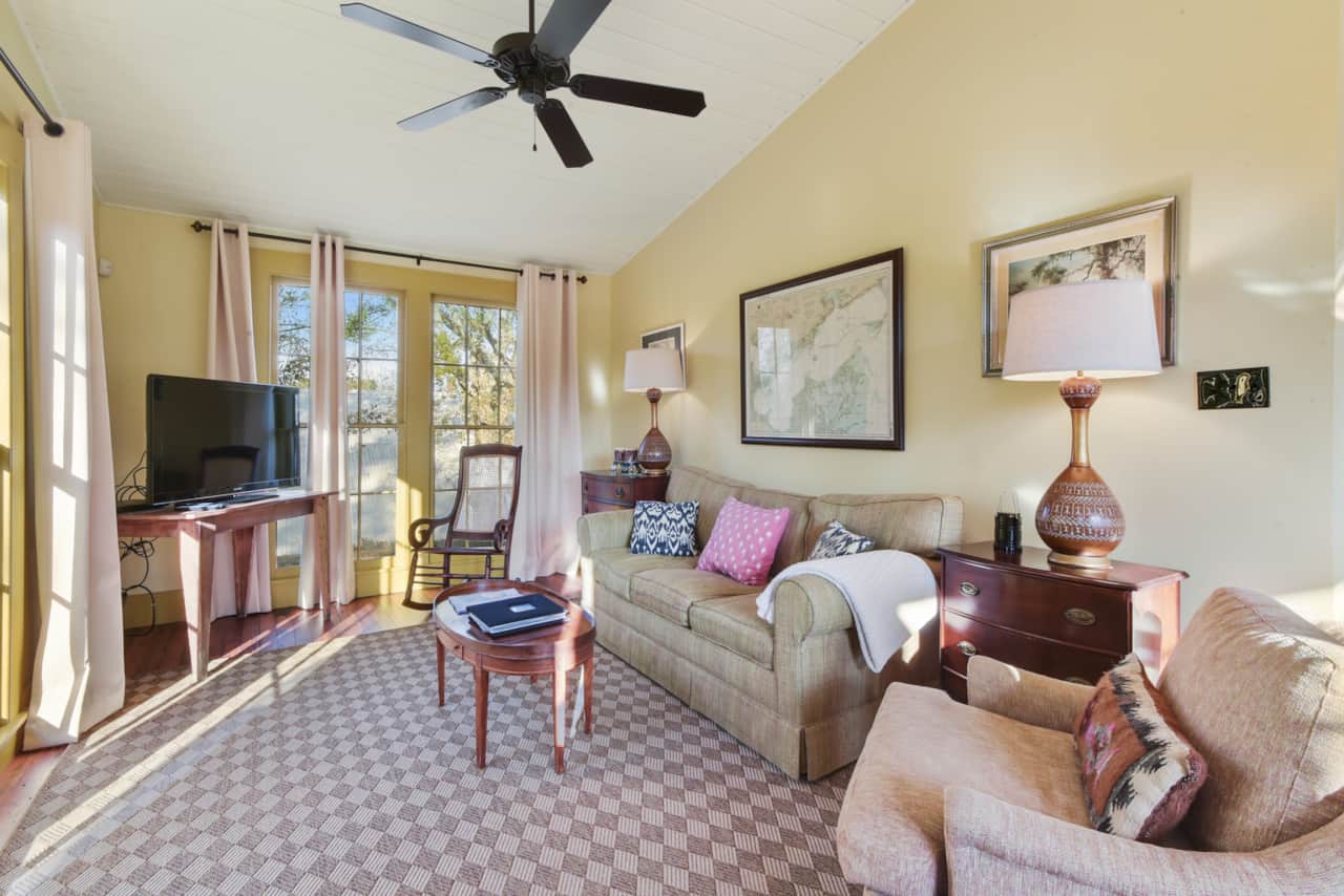 Living room with comfortable seating and flat-screen TV. 