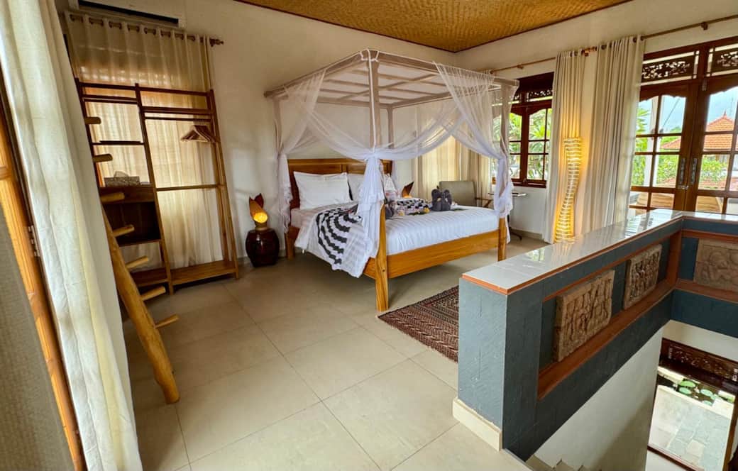 Bedroom 2 with access to wrap around balcony and seating area 