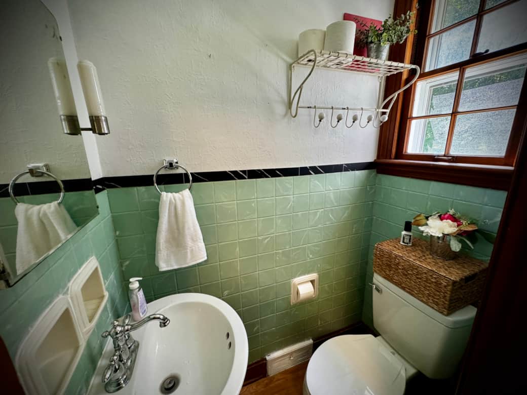 Half bath with original 1940s green tiles