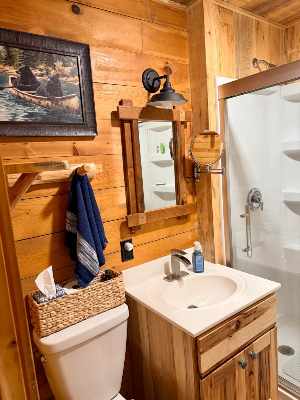 The brightly lit bathroom also has a magnifying mirror. 