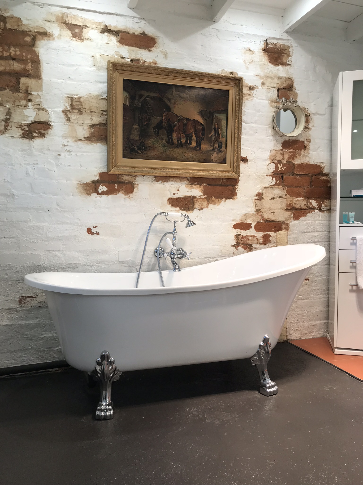 Bathroom with clawfoot bathtub and shower