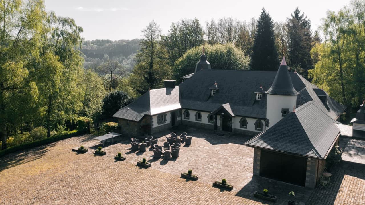 Aerial view of Le Châtelet in a wooded setting