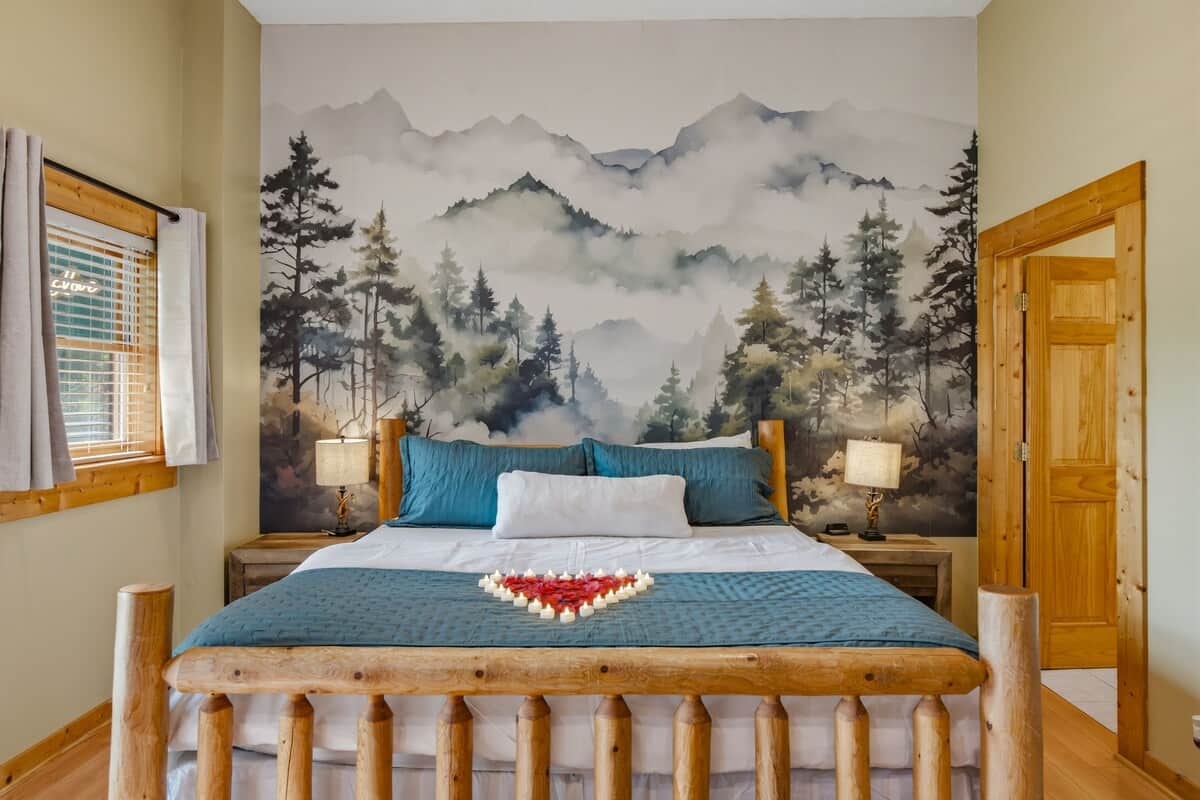 Romance package for extra $40: heart shaped rose decor, surrounded by flameless LED candles on bed with a trail of artificial rose petals