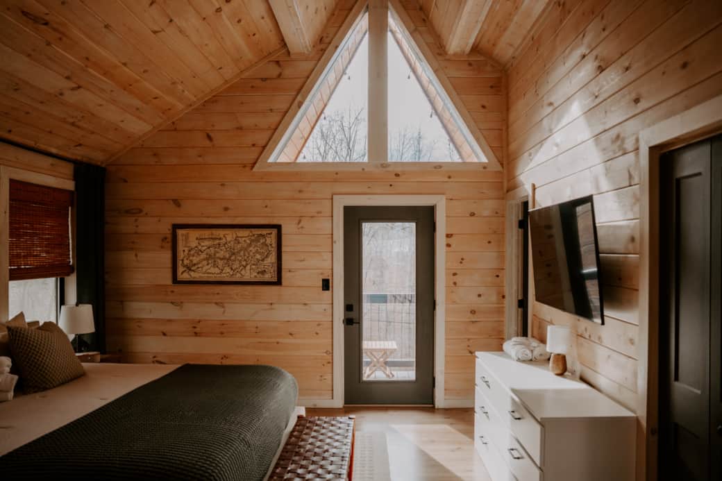 Spacious master bedroom with king bed, vaulted ceilings, and balcony Spacious master bedroom with king bed, vaulted ceilings, and balcony