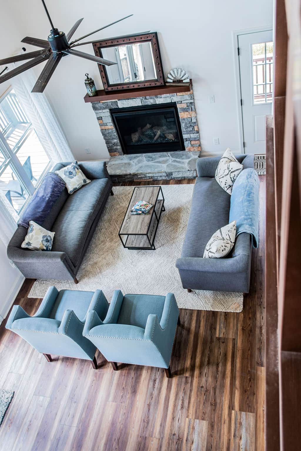 From the top of the stairs down to the main floor living room.