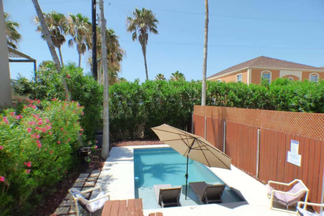 Your Balcony overlooks your private pool , picnic area, and place for your family to gather and eat meals. There is an 8 ft. fence for your privacy. you will find loungers and a picnic table for gatherings.