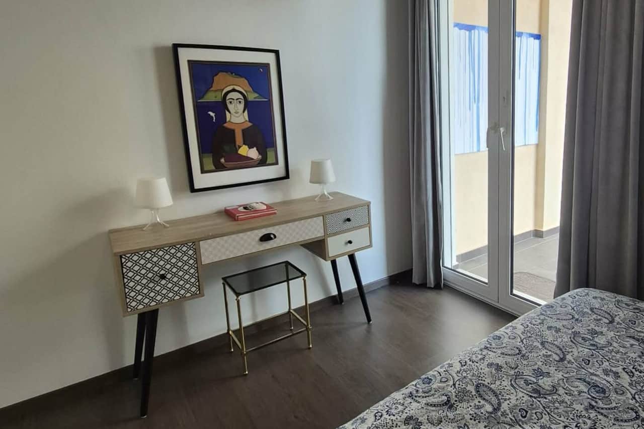The bedroom is located at the rear for absolute peace and privacy, offering a closed space with a large wardrobe and soft, comfortable bedding. It is designed for restful nights, and features its own air conditioning for a perfect sleep. Always cool.