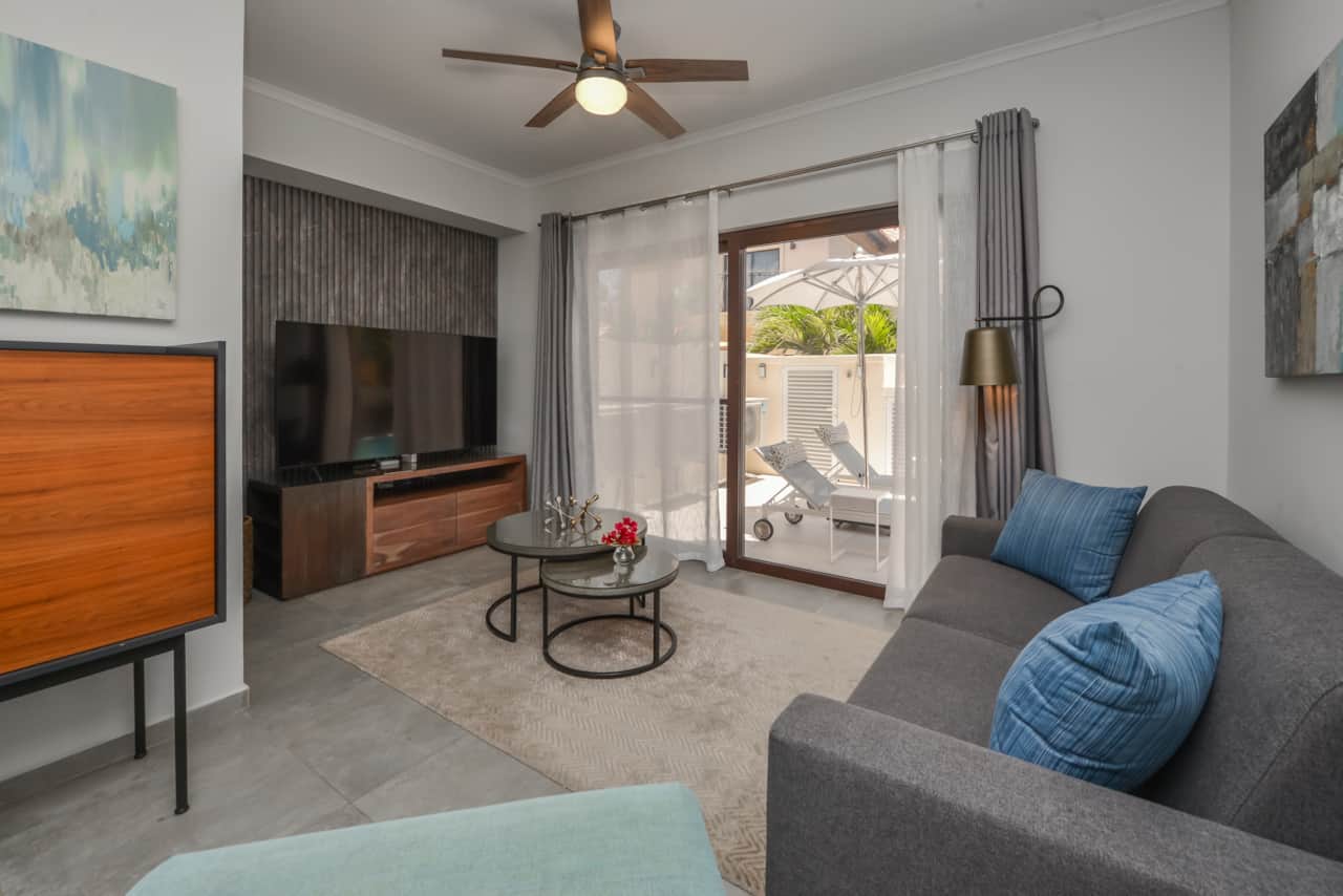Living room with smart TV & cable and walk-out to backyard