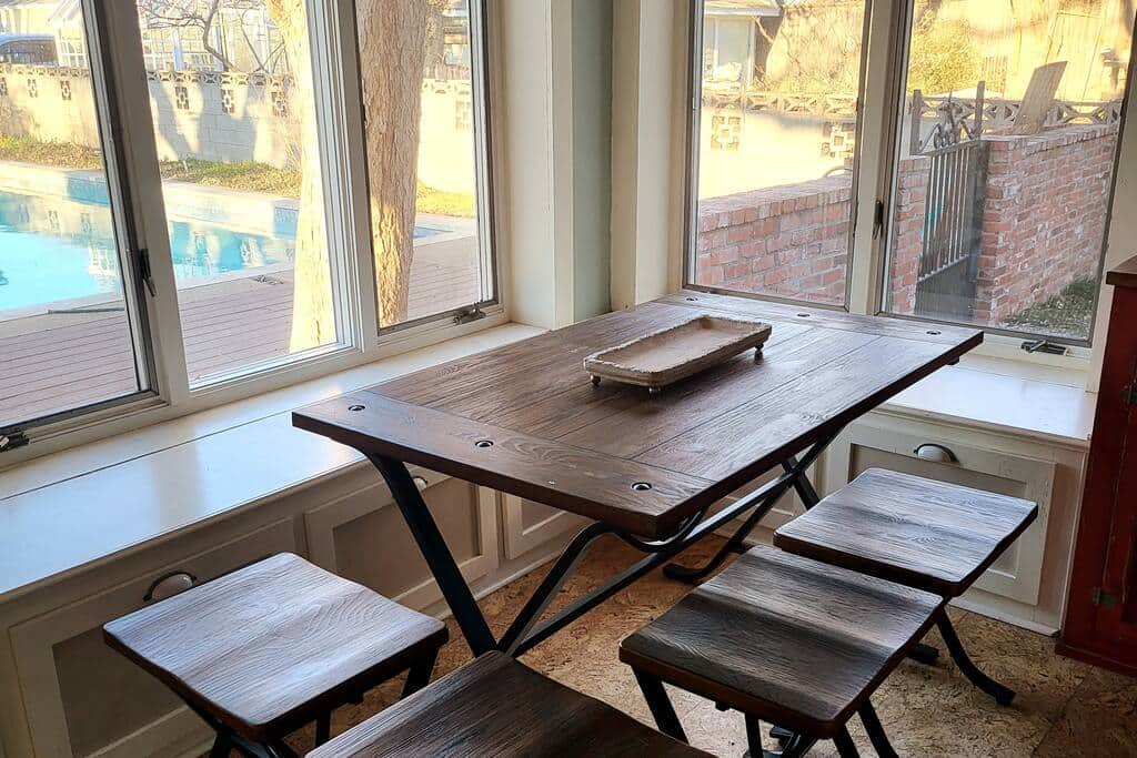 Breakfast nook with large windows and great view of the pool.