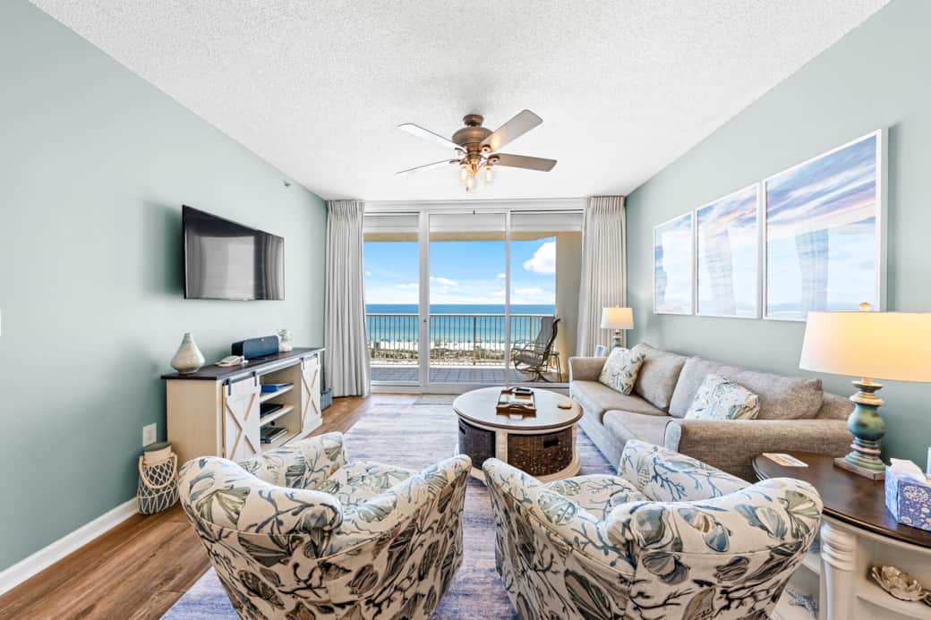 Bright, open living area with comfy seating and beach-inspired décor.