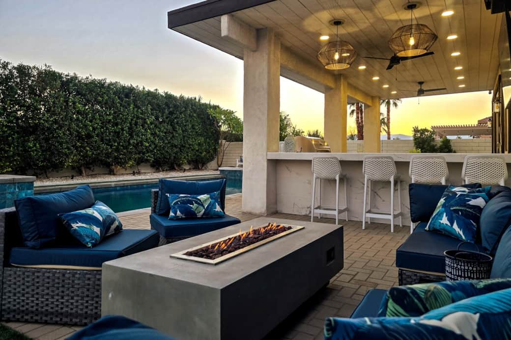 Amazing outdoor space featuring an outdoor fire, ideal for evening relaxation and sunset gatherings. Enjoy comfortable seating, cozy natural gas fire pit, bar and barstools plus natural gas BBQ. 