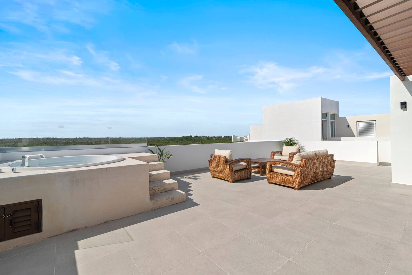 Relax on your private rooftop terrace featuring comfortable lounge seating, a private hot tub, and breathtaking panoramic Akumal jungle views. The perfect place to unwind, soak up the sun, or enjoy a peaceful sunset.