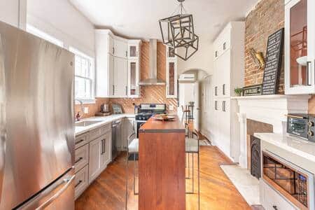 Fully stocked eat-in kitchen with ton of pantry space, and cabinets.