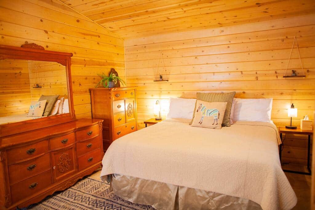 Master bedroom upstairs. King bed opposite loft bed and queen (no walls separating the beds). Master bedroom upstairs. King bed opposite loft bed and queen (no walls separating the beds).