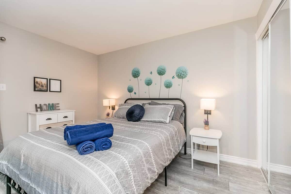 Queen size bed. New mattress. Chest of drawers and closets. Bedside tables with drawers.