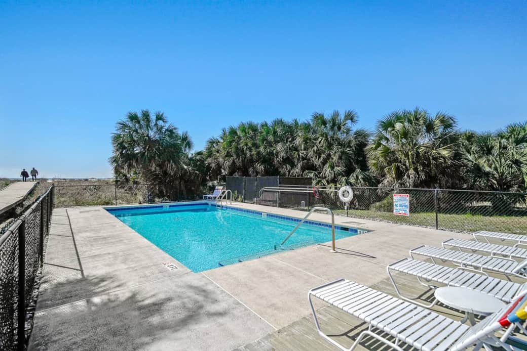 Swim in the pool or stroll the boardwalk to the sand—relaxation is right outside your door. Swim in the pool or stroll the boardwalk to the sand—relaxation is right outside your door.