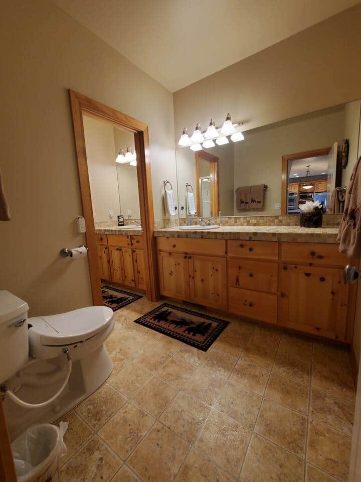 Downstairs bathroom features 2 sinks, walk in shower, and bidet equipped toilet.