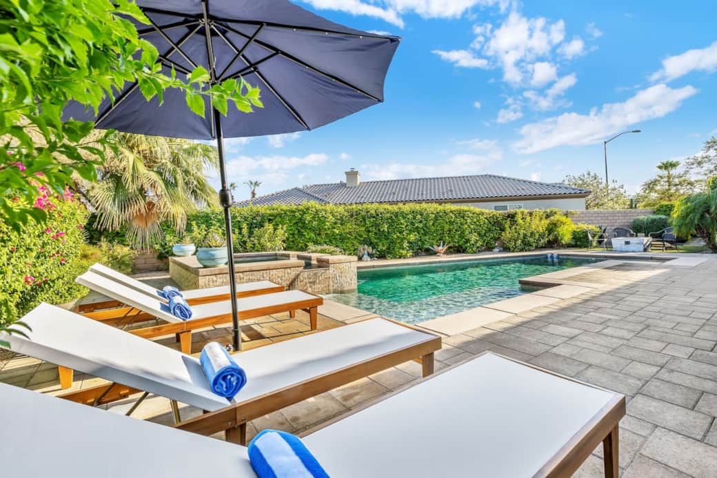 Resort-style poolside area, perfect for relaxing in the shade.