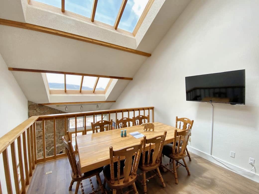 8-person dining room table with additional bar seating.