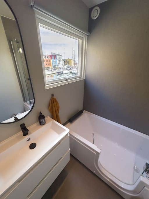 Enjoy stunning harbor views from the bathroom window as you get ready for the day