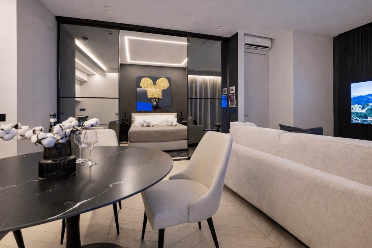 AZULIS open-plan living and dining area with bedroom view in Olbia by RENTAL12